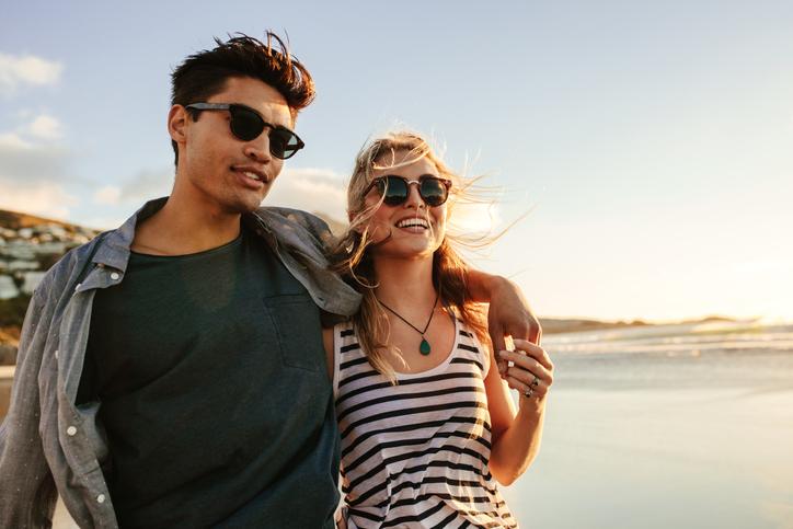 Couple wearing sunglasses in summer