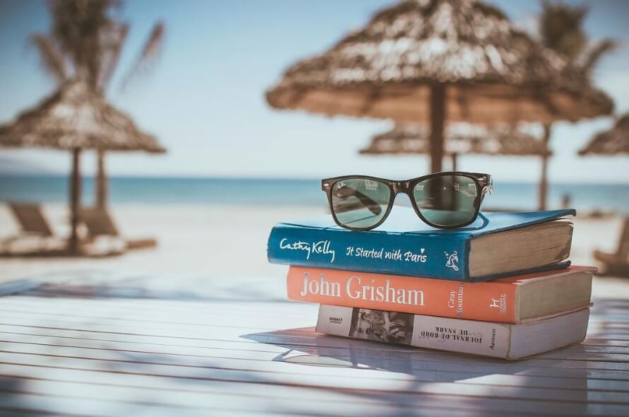 Sunglasses on top of the books